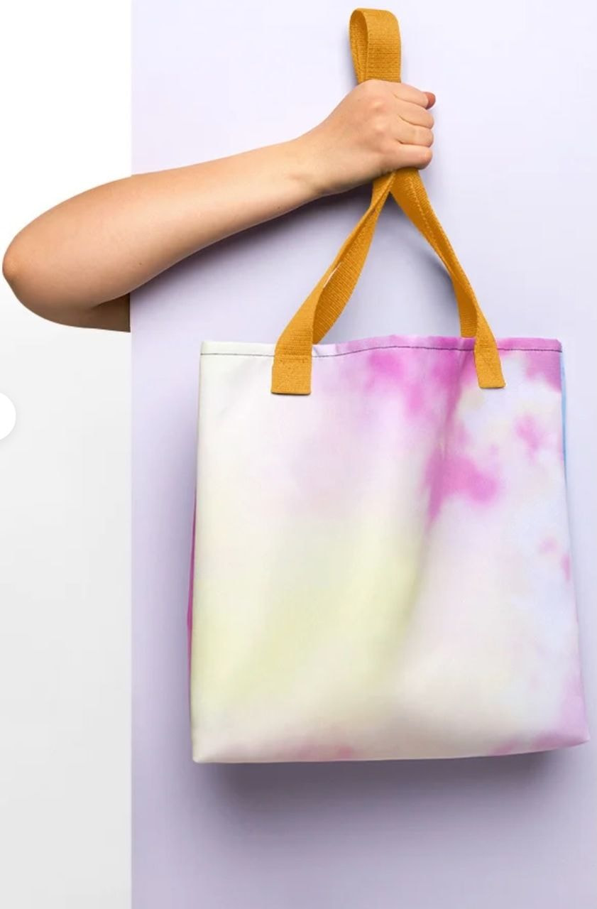 a hand holding a bag